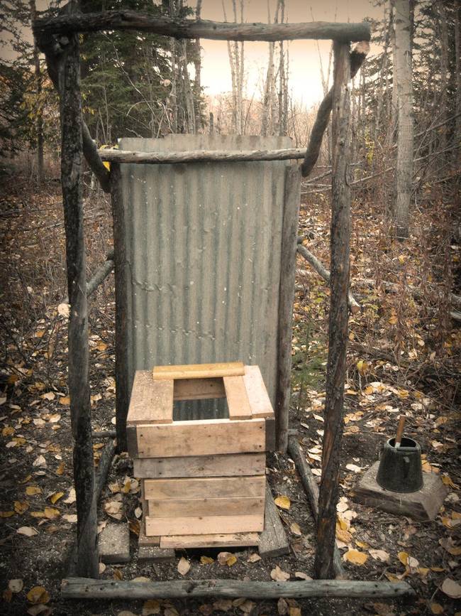 All this outhouse is missing is walls, toilet paper, and running water.