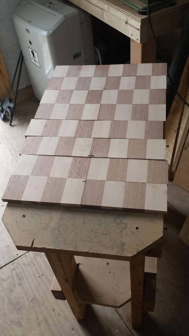 Here's the finished board. Since it wasn't completely symmetrical, he glued it evenly to the back of the cabinet.