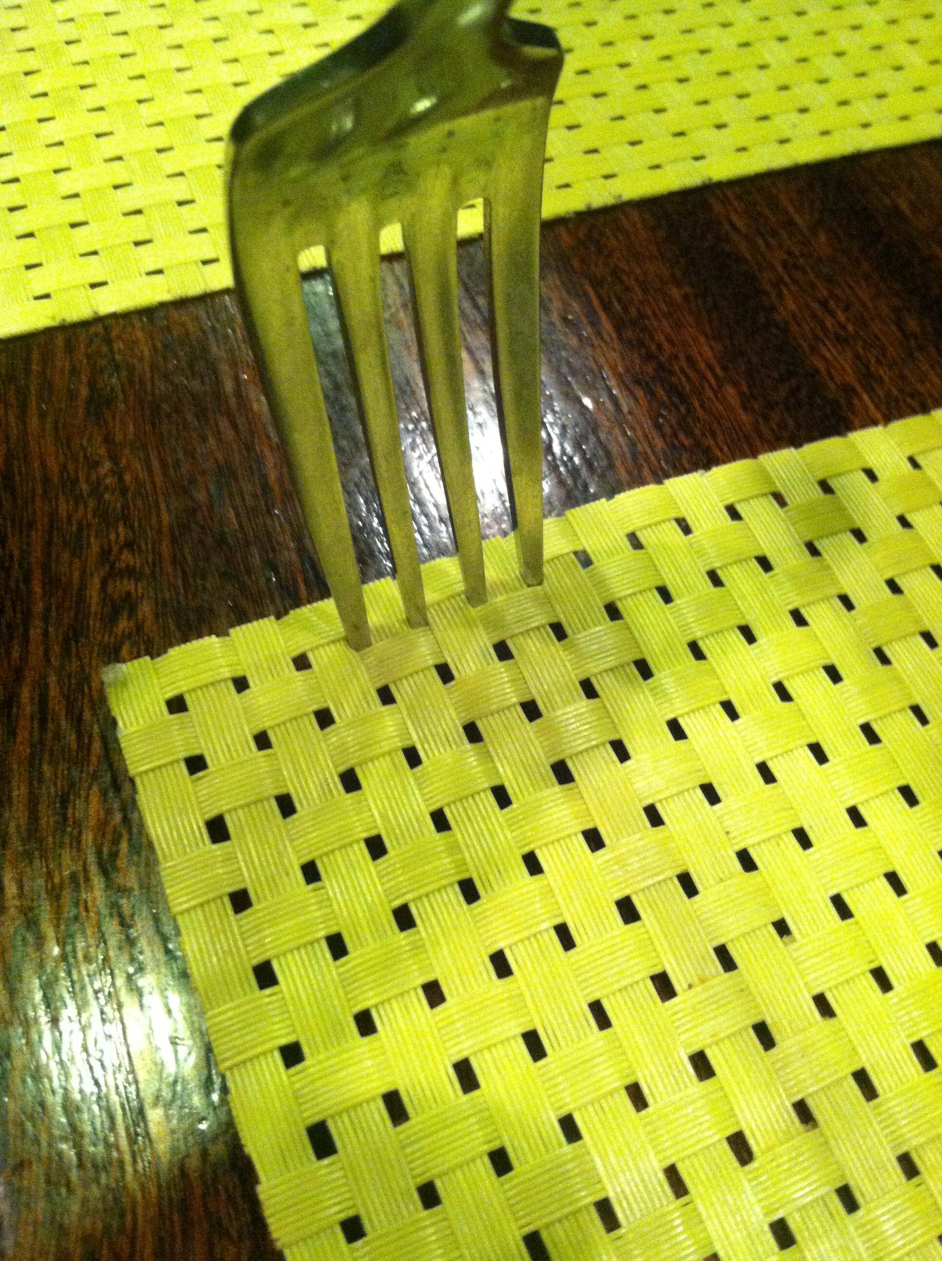 11. A fork that stuck right into a place mat.