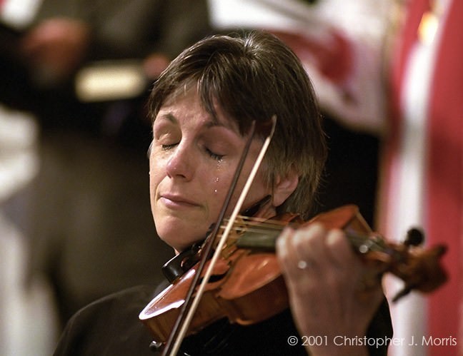 12.) Violinist, Nancy Dinovo, cries during a service at Christ Church Cathedral in Vancouver for the 9/11 victims.