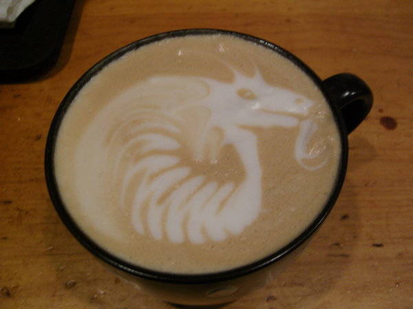 This dragon is a combination of poured and etched latte art.