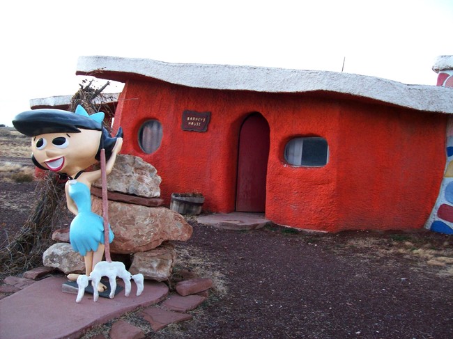 The Rubbles' house, with Betty. The buildings, which include the characters' houses as well as some Bedrock shops, are all made of brightly-painted concrete, and probably keep pretty cool in the desert heat.