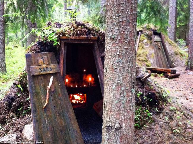 Guests at Kolarbyn stay in a hut that seems to rise right out of the ground in the forest.