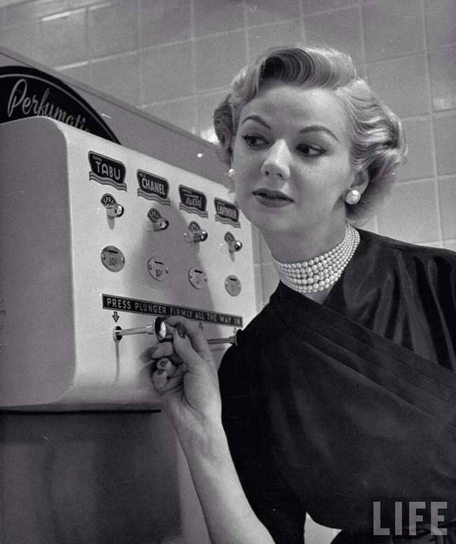 A coin operated perfume dispenser.