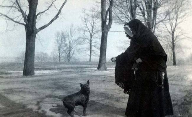 16.) A ghostly-looking nun walking her dog in 1900.