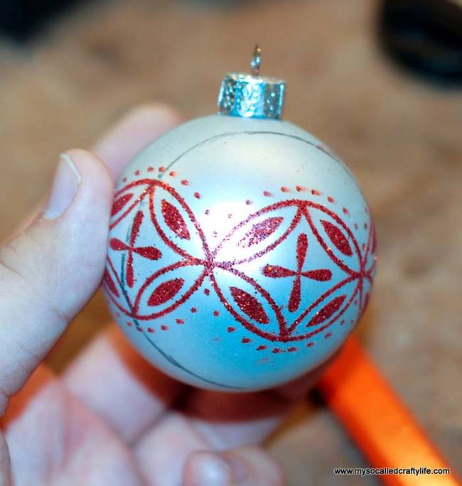 Start by drawing a circle around your ornament about a half inch away from the metal top.