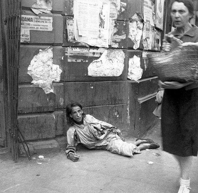 21. Despair - This woman was starving to death on the streets of the Warsaw ghetto.