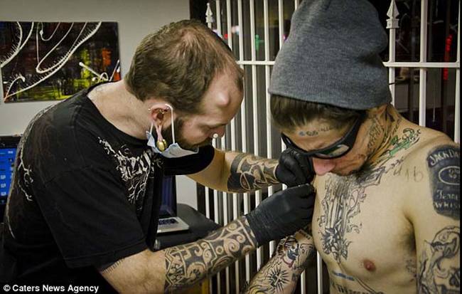 Body modification specialist Russ Foxx was the one doing the piercing on the self-proclaimed tattoo addict's body.