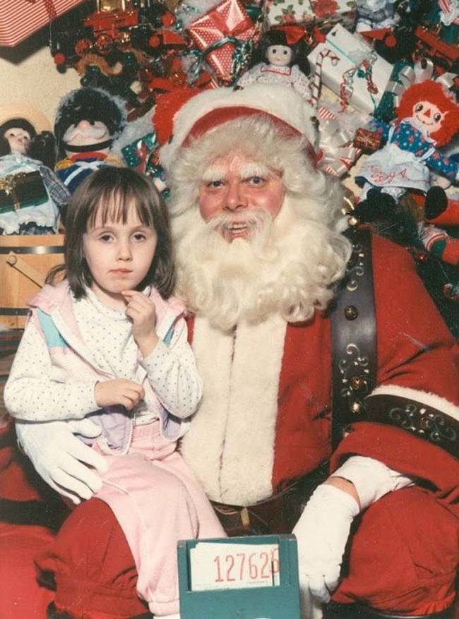 Something tells me Santa and this little girl are conspiring about something.