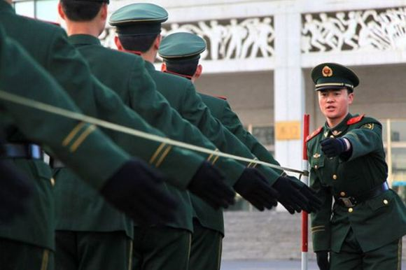 2.) The Republic of China Military Police teach their men the proper height to raise their arms while marching using wires attached to poles.