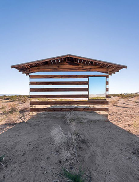 This house disappears into its desert surroundings