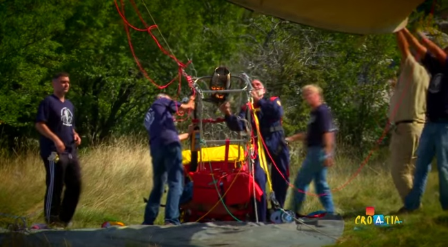 Trifonov and his crew begin blowing up the balloon.