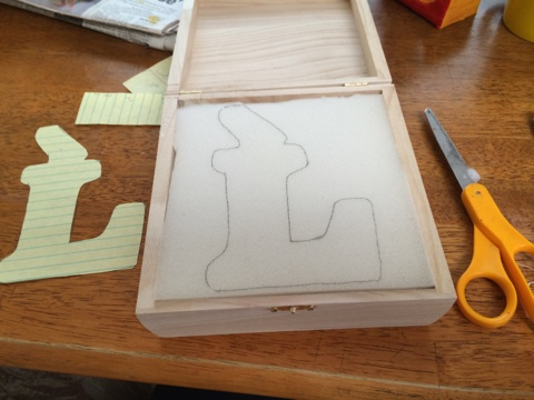 Next came the box: she traced the letter into foam making sure to leave room for the wick.