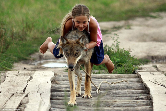 She even takes a lift on her furry pal from time to time.