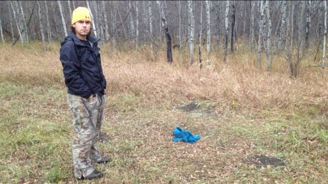 Greg Zubiak in the field where he found the puppies.