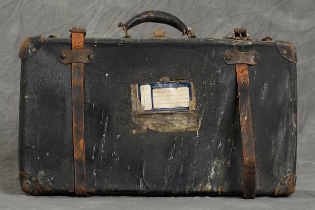 The exterior of a suitcase left in what was the Willard Asylum for the Insane.