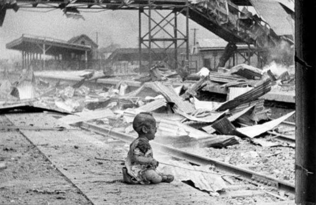 25.) A baby cries at a bombed train station in Shanghai (1937).