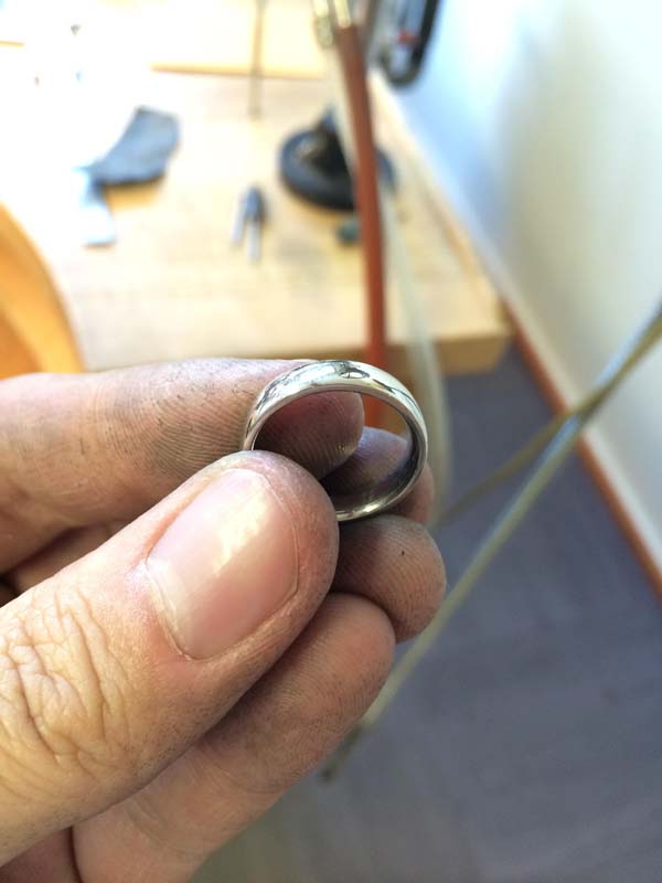 "The interior, once shaped, is pretty rough. Smoothing is done via rotary tool, sandpaper, polishing cloth, and whatever else you can get your hands on that will remove material smoothly. The ring gets VERY hot from the friction so you end up taking frequent breaks to give your toasty digits a rest."