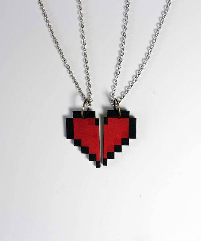 Show your loved ones you care by giving them a homemade half-heart, <a href="https://ournerdhome.com/8-bit-heart-necklace/"><i>Legend of Zelda</i> 8-bit necklace</a>. Keep the other awesome half for yourself.