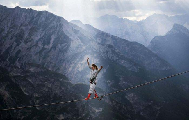 Good thing she has a safety harness on. The scenery is breathtaking though.