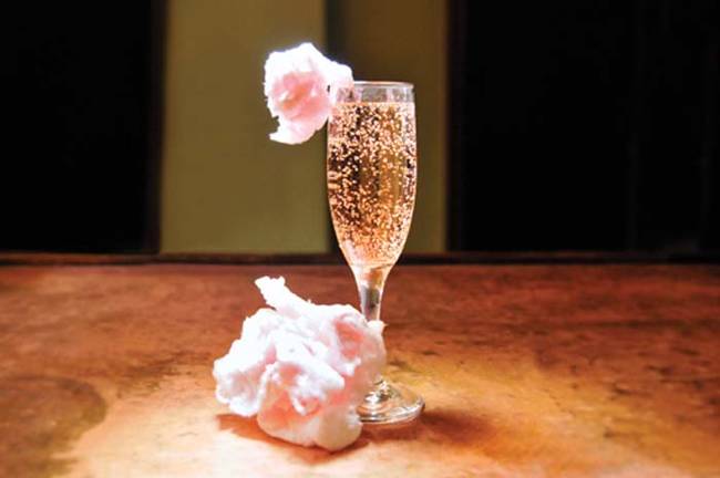 11.) Garnish pink champagne with <a href="https://hercincinnati.com/articles/2013/01/25/cotton_candy_champagne_cocktail" target="_blank">cotton candy</a>.