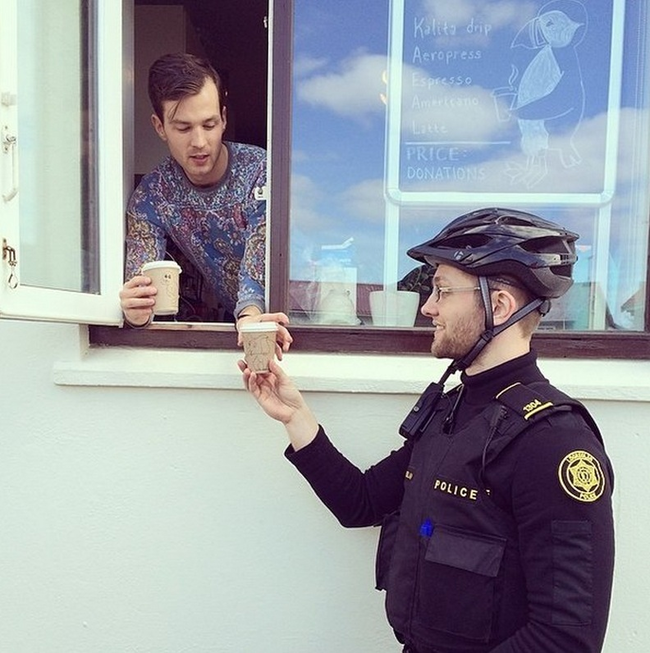 "Officer, make sure to not hold this coffee by the lid. Don't want it to spill, it's very hot."