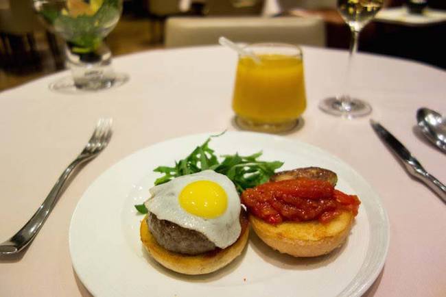 A sample of the food in The Private Room. U.S. Prime Beef Burger with Foie Gras, Rocket Leaf, and Fried Quail Egg. No big deal.