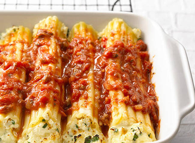 <a href="https://www.dairygoodness.ca/recipes/baked-manicotti-cooking-club-size" target="_blank">Manicotti</a>