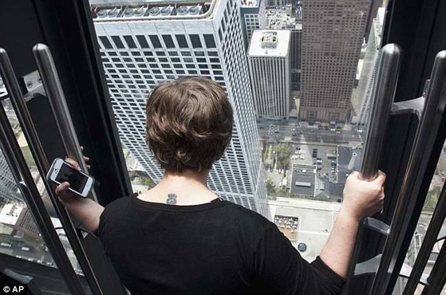 The viewing tilting platform, known aptly as TILT, is located in Chicago's John Hancock Tower.