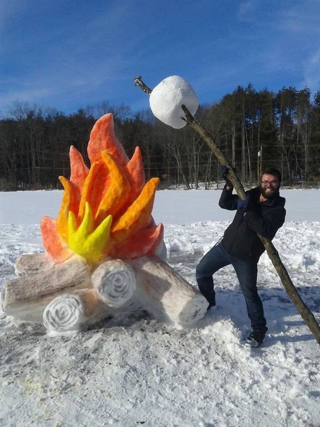 Here's Schaffer roasting a faux (or snow) marshmallow over the fire.