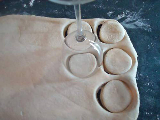 Use a  wine glass to create perfectly sized biscuits.