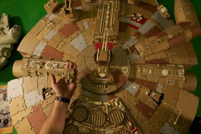 It's a big model, too. Here's a shot showing the scale of the finished Millennium Falcon next to a hand holding a little Millennium Falcon.