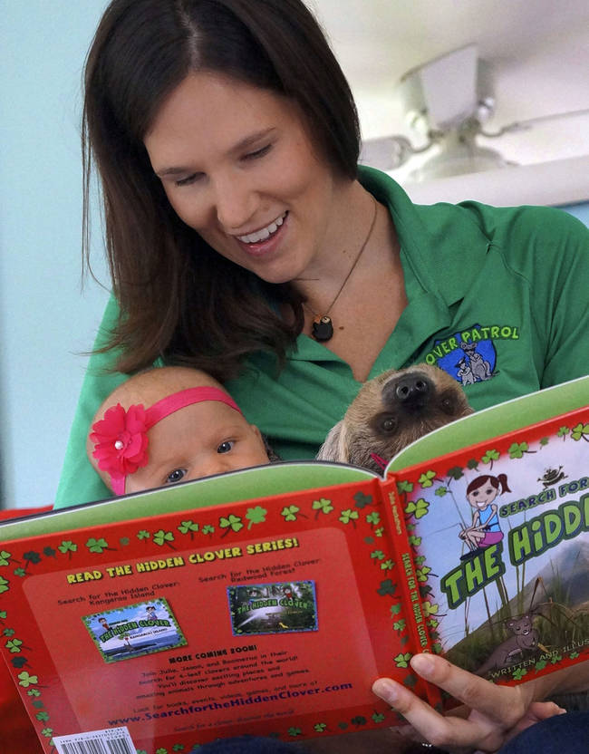 Alia's mother and father are both animal enthusiasts and conservationists who adopt and take care of many animals. Julia actually writes <a href="https://www.searchforthehiddenclover.com">books for children</a> meant to be both fun and educational. Here she is reading to Alia and Daisy.