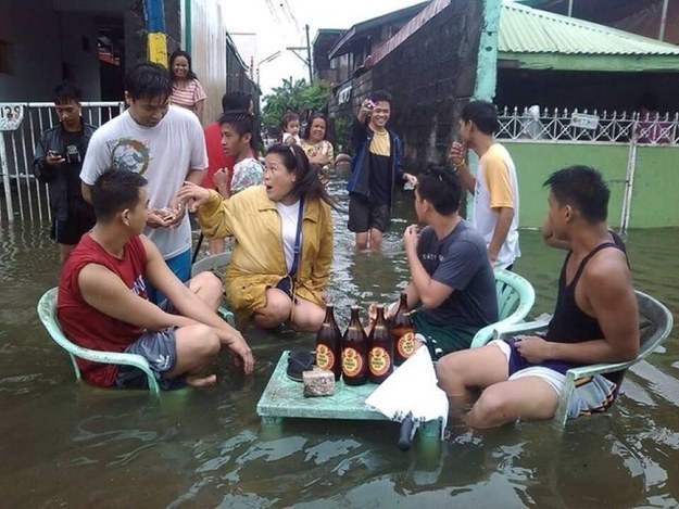 13. The locals don't let the rain stop them from having a good time.