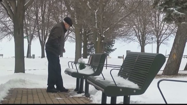 Bud Caldwell visiting his wife Betty's memorial bench.