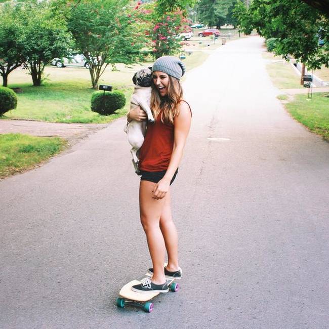 Doug skate-boarding with his owner/best-friend, Leslie.