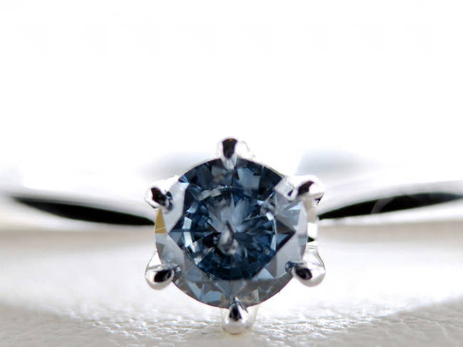 A cut and polished diamond. The blue color comes from the amount of boron present in the ashes.