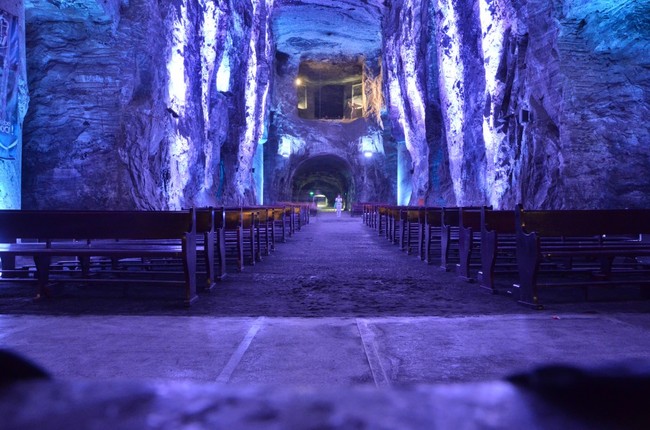 The church is built to look like traditional, above-ground churches, with a long aisle (called a nave), pews, and a main altar in the apse. It also has other small chapels.