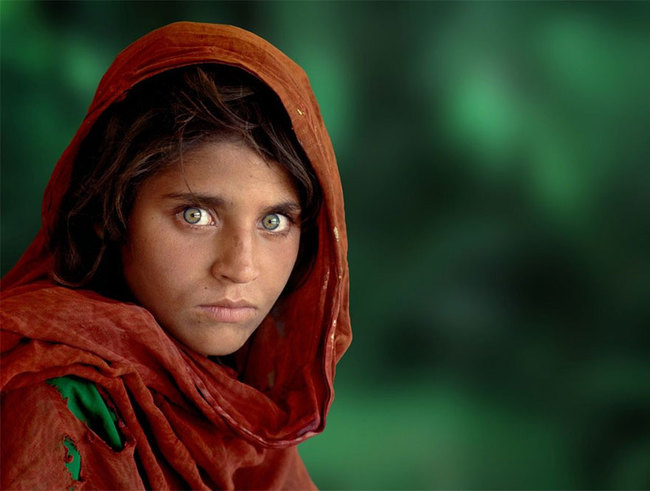 17. Caution - Sharbat Gula was orphaned during the Soviet Union’s bombing of Afghanistan and sent to the Nasir Bagh refugee camp in Pakistan in 1984.