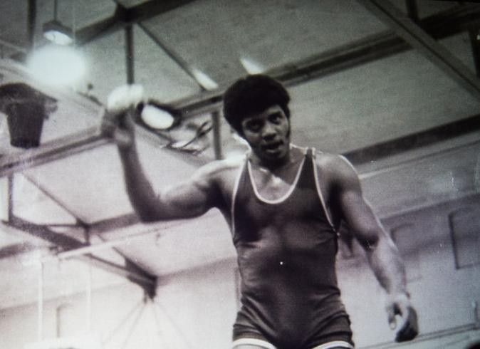 Cosmos host and astrophysicist Neil DeGrasse Tyson at a college wrestling match.