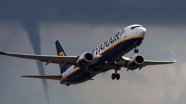 Recently a Ryanair plane took off from East Midland Airport in England...with a tornado in the background!