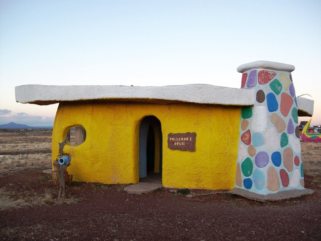 Other buildings include the grocery store, barber shop, and the police station, seen here. They all have Stone Age-themed puns in and around them as well. 