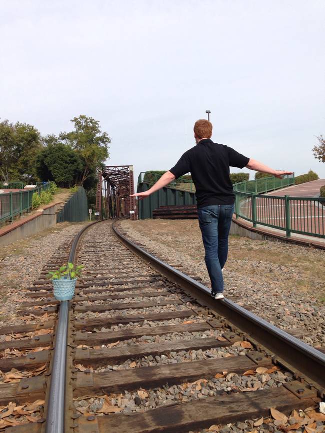 Playing on the train tracks.