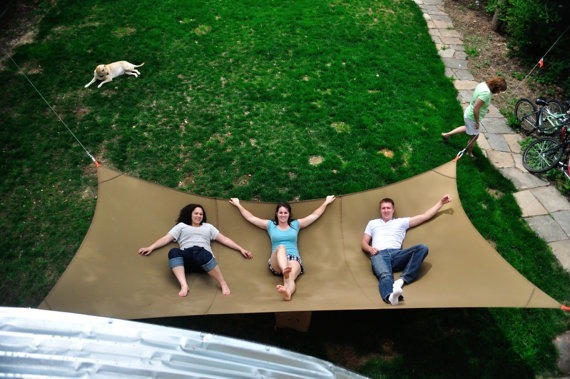 16. Chillax with friends on this <a href="https://www.etsy.com/listing/192732193/mega-hammock?geo=global&utm_medium=social_organic&utm_source=twitter&utm_campaign=global_item_megahammock" target="_blank">mega-hammock</a>.