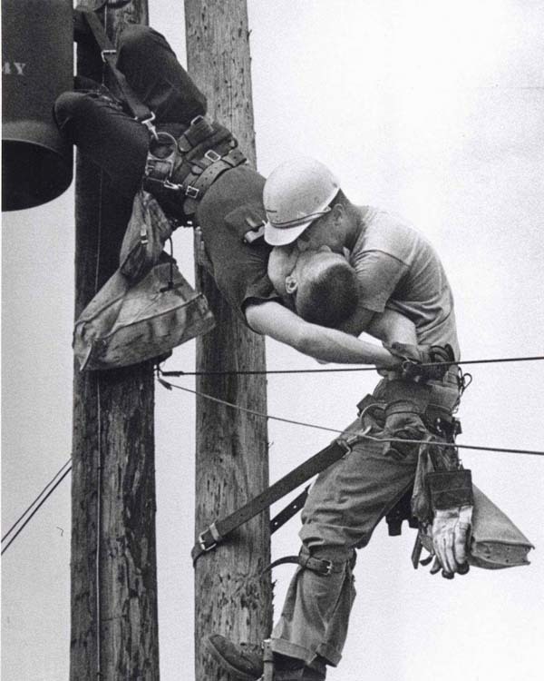 42.) A dramatic photo of a utility worker receiving CPR after being electrocuted, "The Kiss Of Life" (1967).