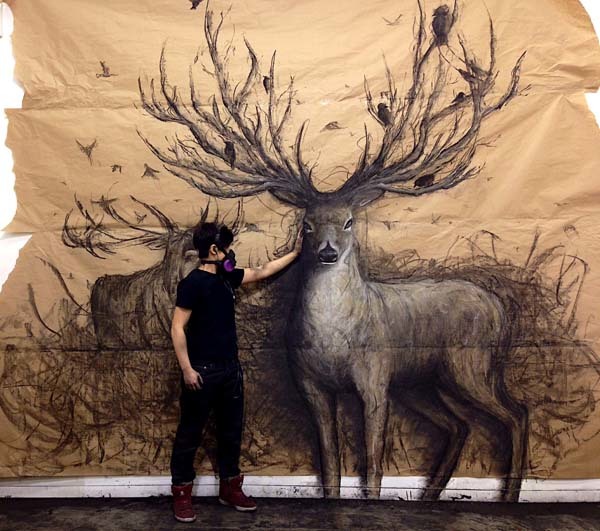 Fiona Tang’s large-scale murals are made using charcoal, chalk pastel, and acrylic on paper.