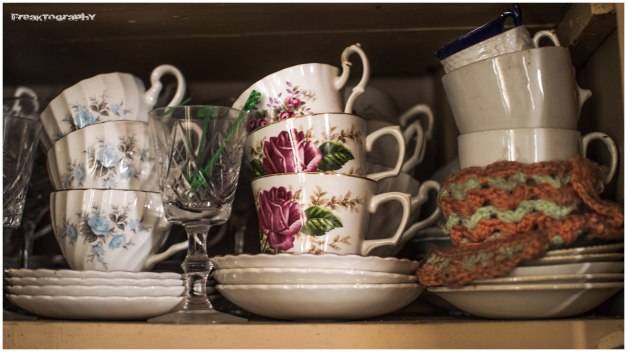 Cups, plates, and other dishes are neatly stacked...and completely untouched.