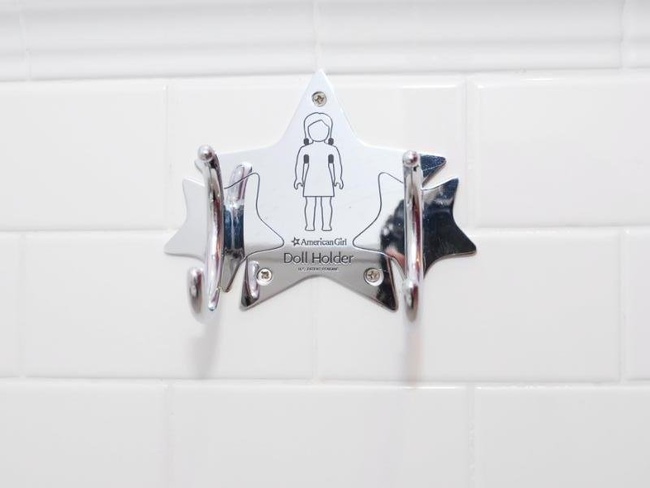 Even if I'd never use this doll holder, I'd love to use this restroom.