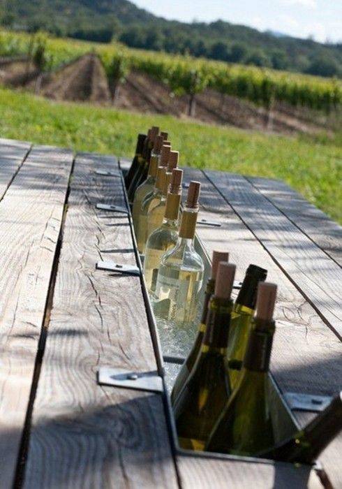 Replace the missing plank from a picnic table with a wine gutter.