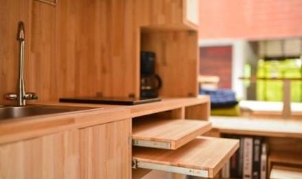 Hidden tables and storage areas are found throughout the kitchen area.